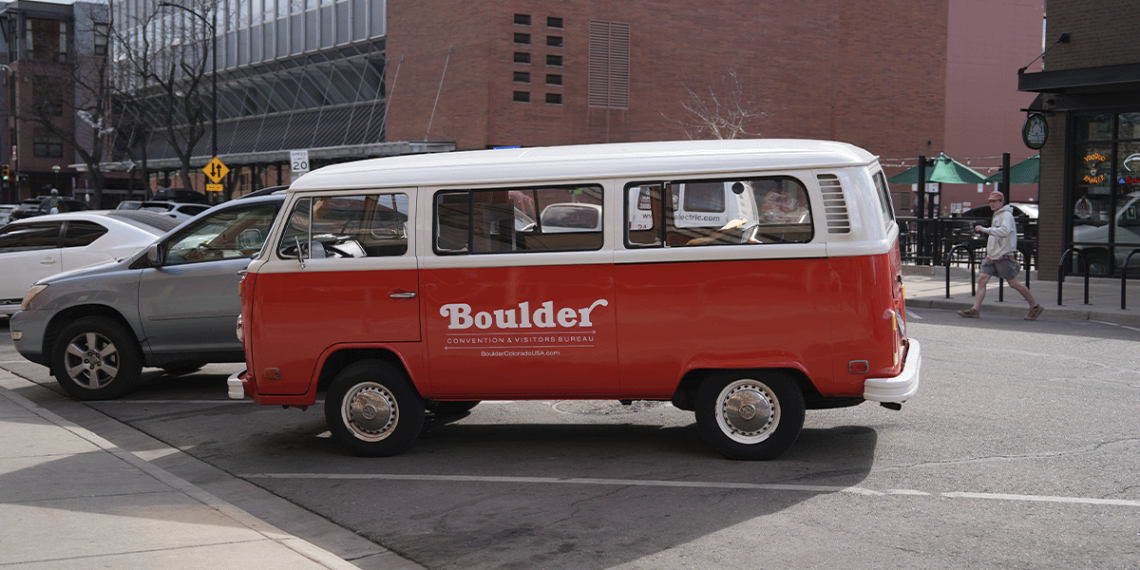 Vintage red and white Boulder van parked