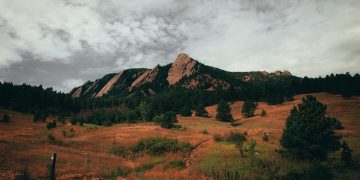 Scenic view of the Flatirons in Boulder, Colorado with hiking trails and forest