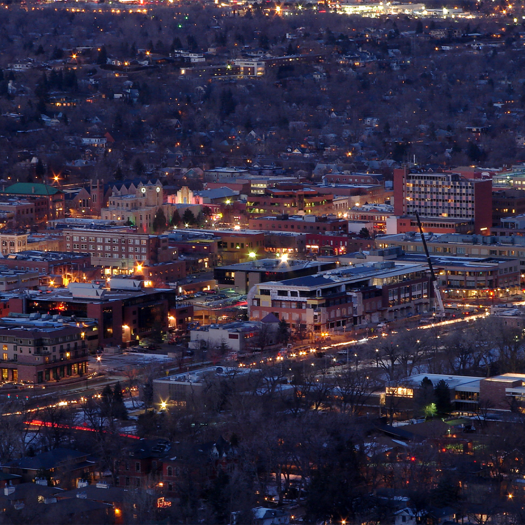 Downtown Boulder at dusk with city lights
