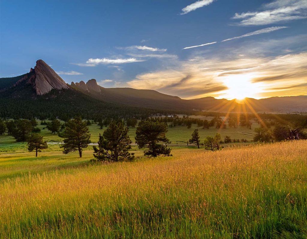 Scenic view of Boulder, Colorado at sunrise with golden fields