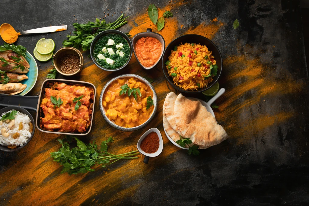Table with Indian food dishes.