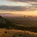 Boulder vs Denver — Flatirons and city skyline at sunset
